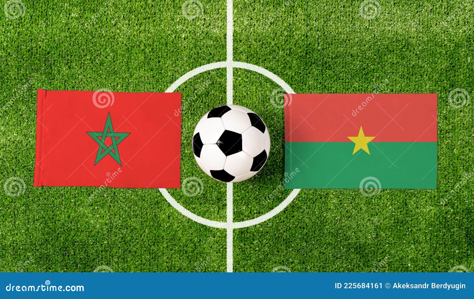Top View Soccer Ball with Morocco Vs. Burkina Faso Flags Match on Green