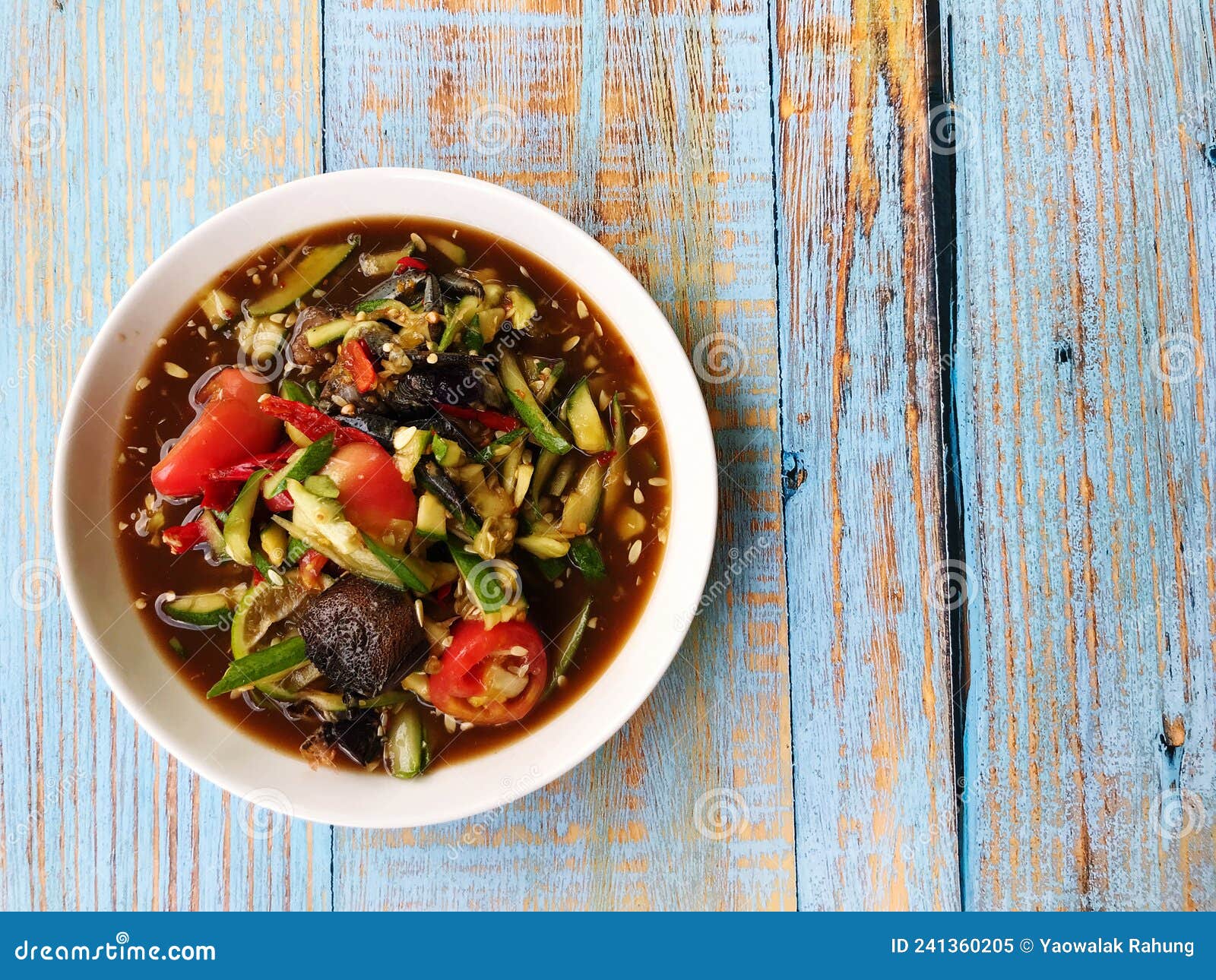 top view of spicy cucumber salad with fermented fish