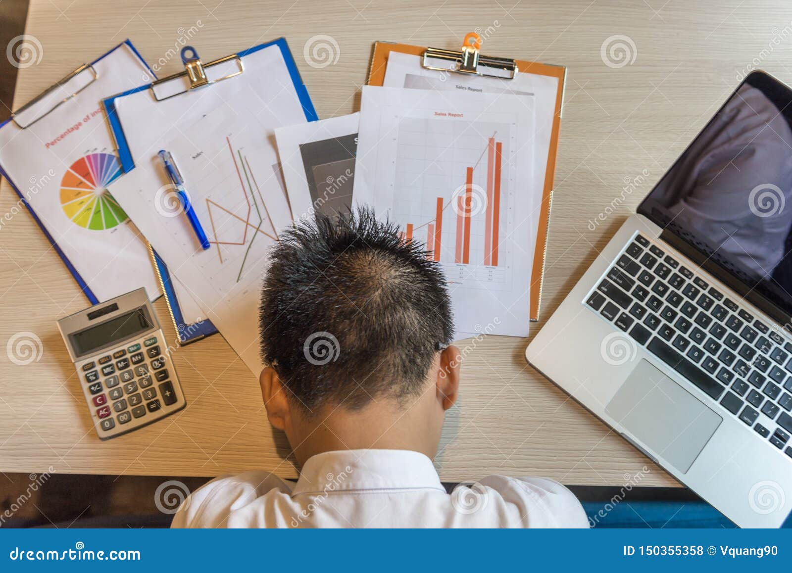 Top View Of Stressed Asian Man Fall Asleep On Desk Stock Photo