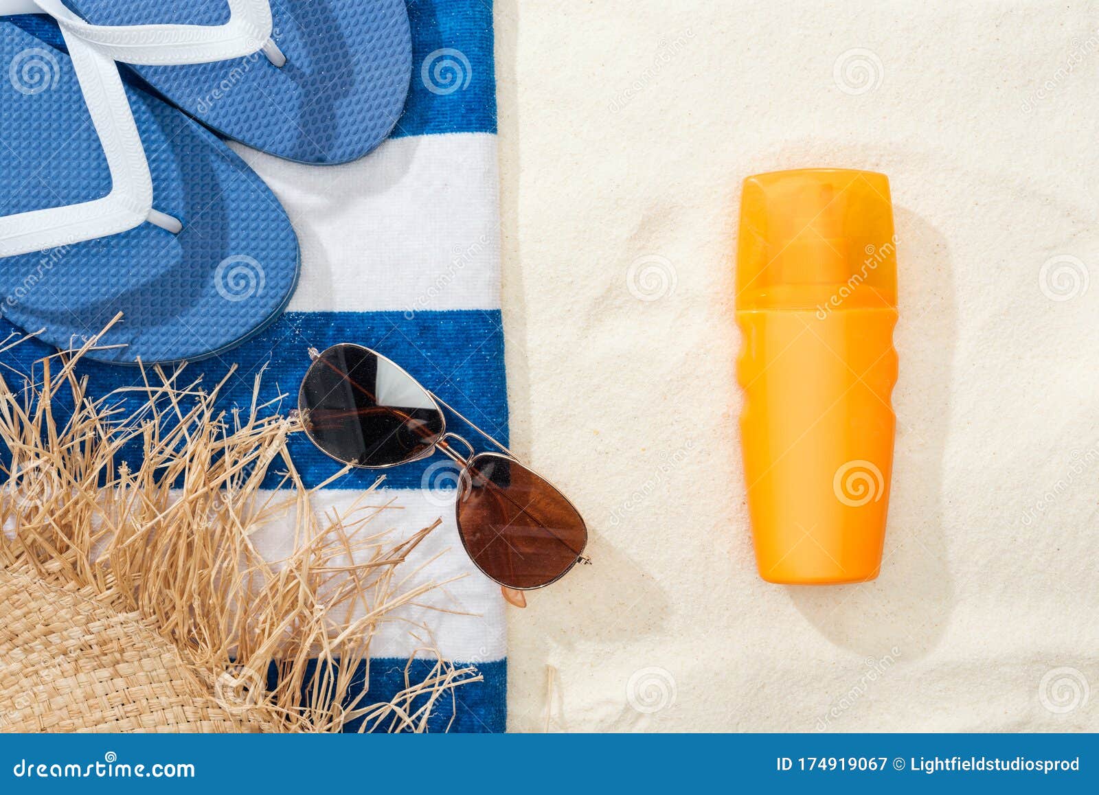 Top View of Sunscreen, Straw Hat, Flip Flops, Sunglasses and Striped ...