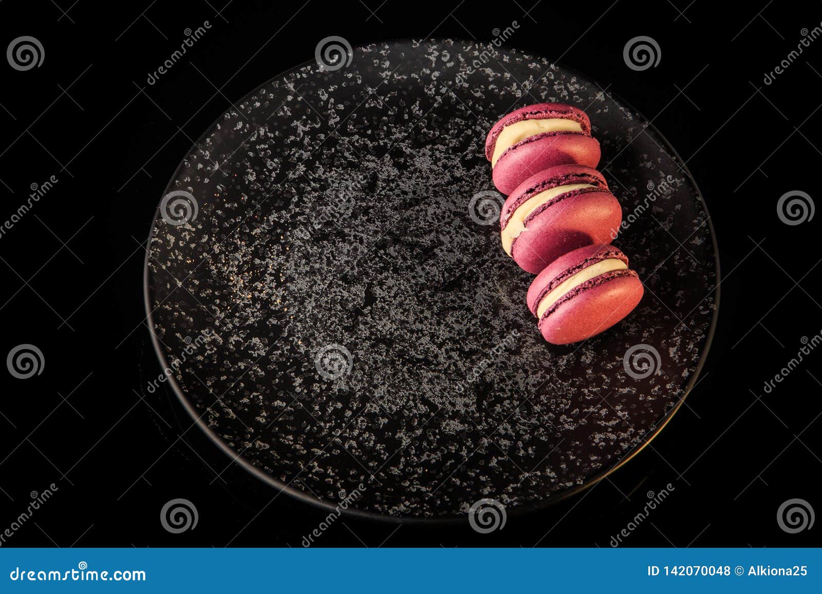 Top View Three Purple Berry Macaroons Served on Black Plate Stock Photo ...