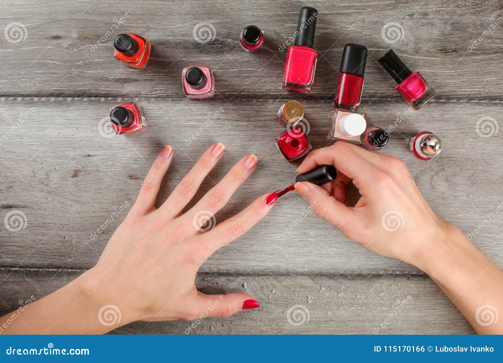 Top View To Woman Hands, Applying Coat of Red Nail Varnish on he Stock ...