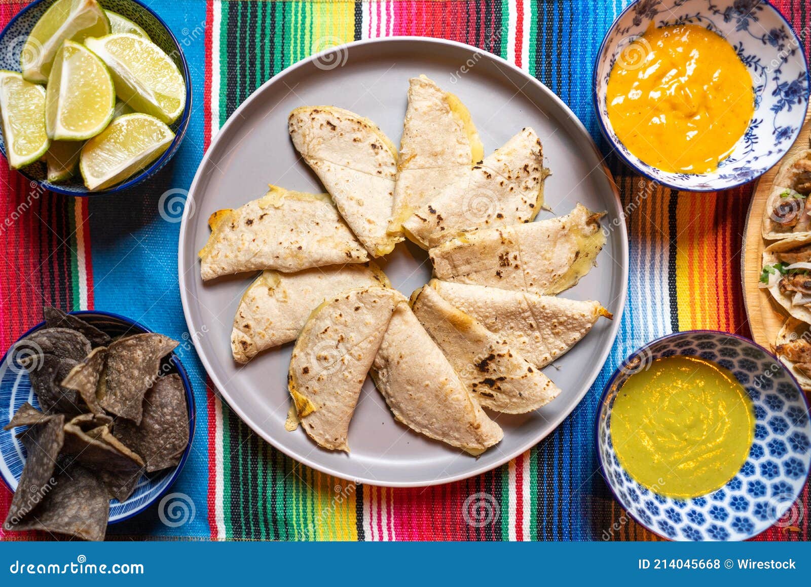 Top View of Tortillas, Sauces, Lime, and Chips for Making Tacos Stock