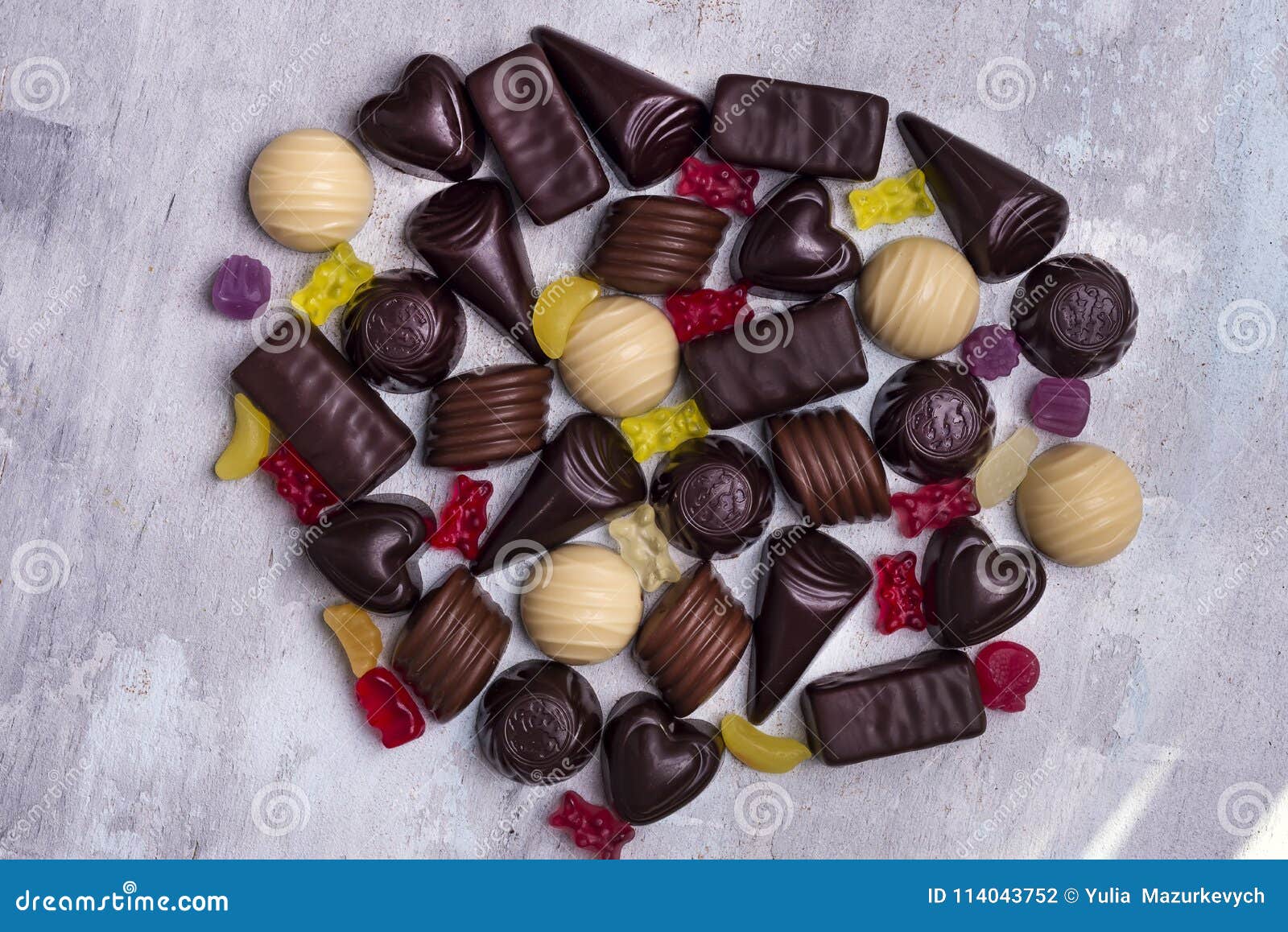various chocolate pralines  on stone background