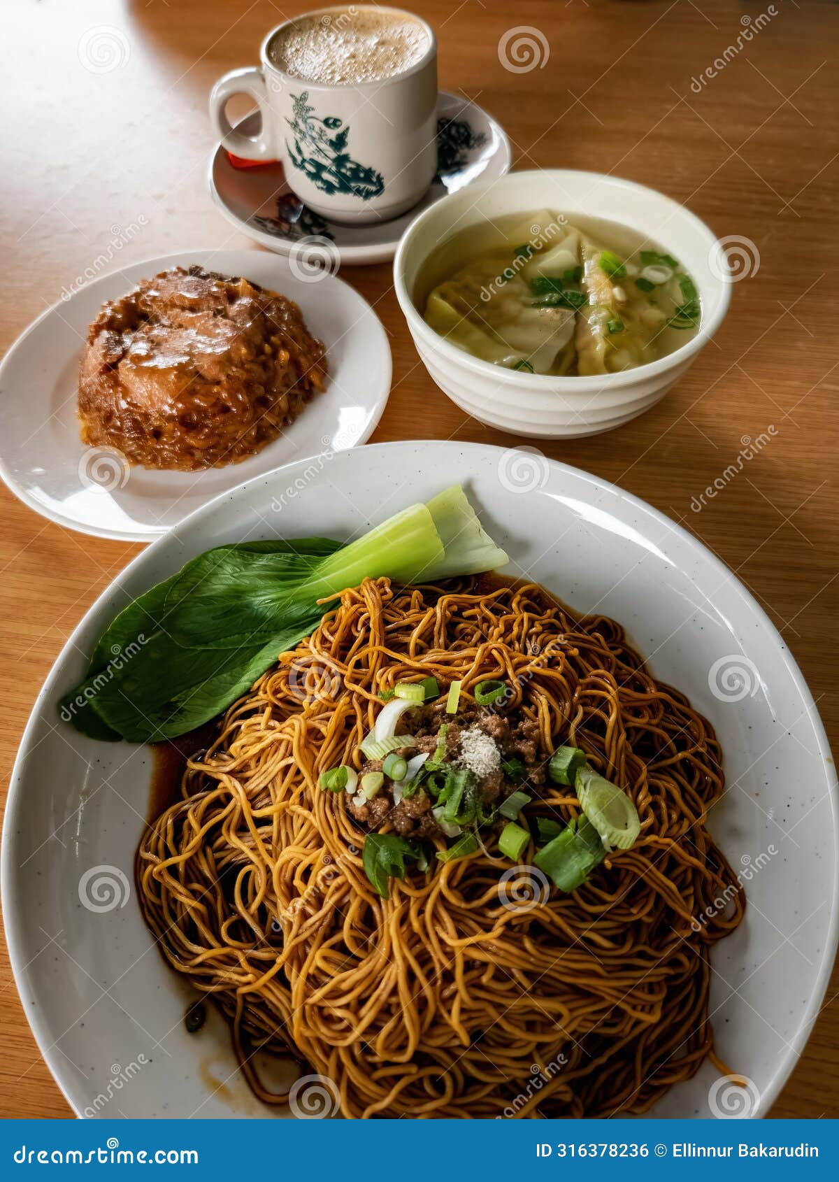 top view of wantan noodles with glutinous rice and white coffe. staple breakfast for malaysian chinese