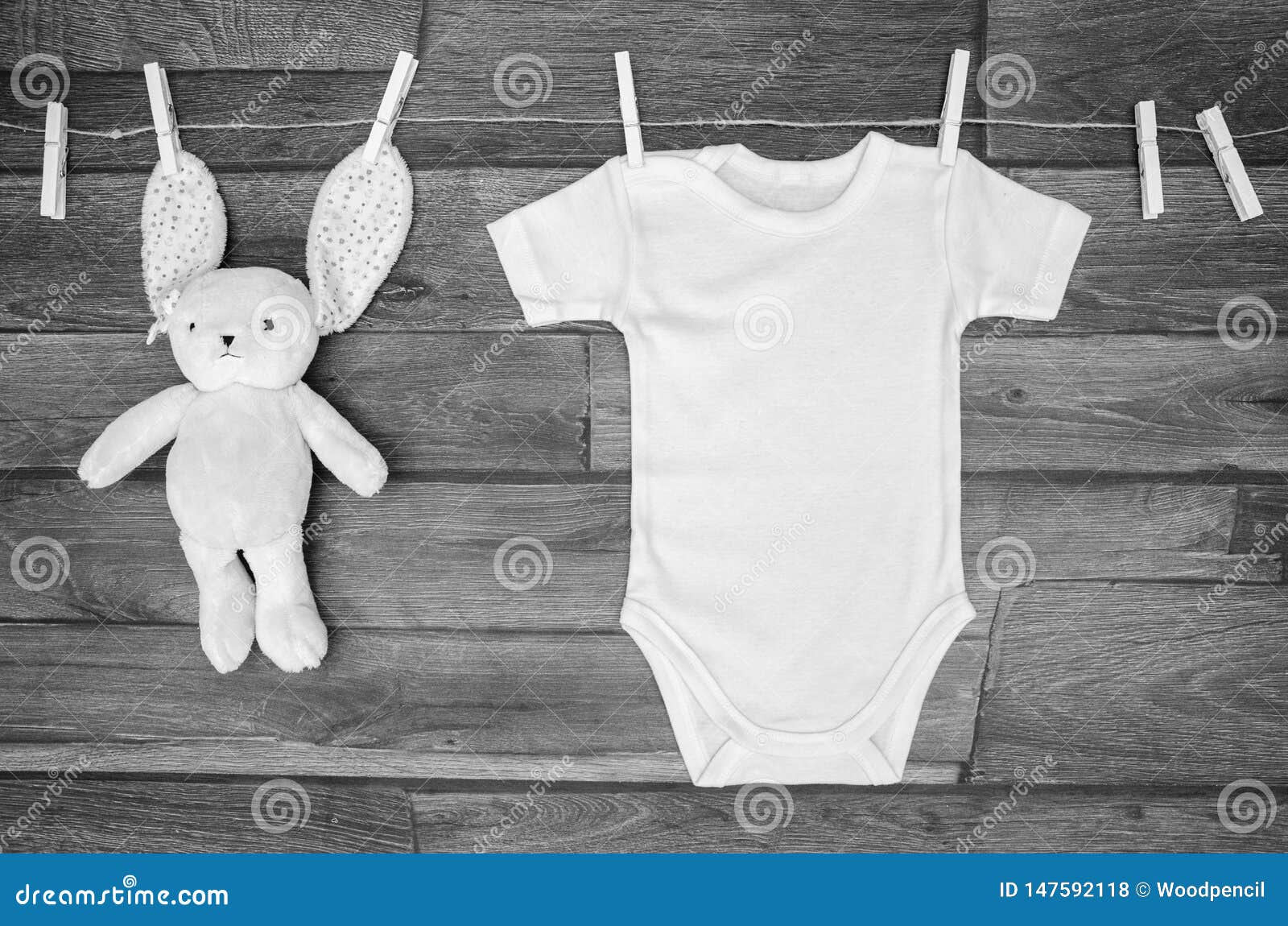 Download Top View White Baby Bodysuit On A Clothesline With Teddy ...