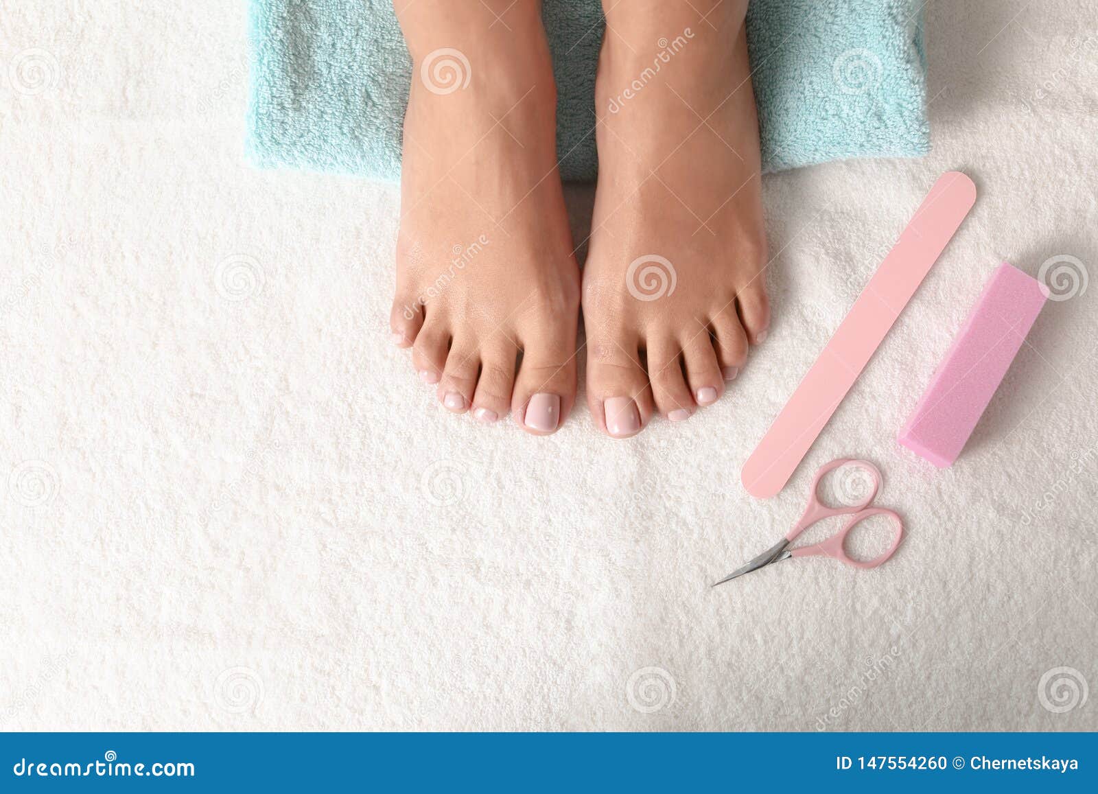 Top View of Woman with Beautiful Feet and Pedicure Accessories on White ...