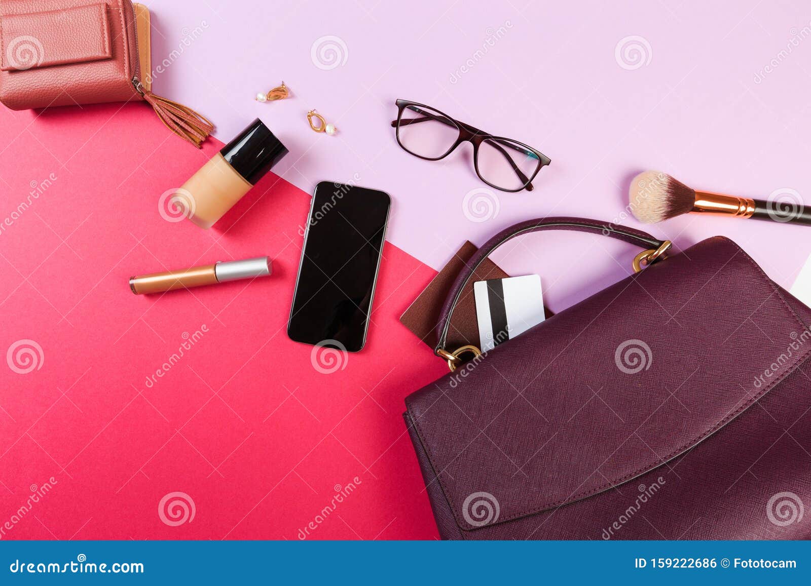 Top View of Women Bag and Lady Stuff with Copyspace on Colour