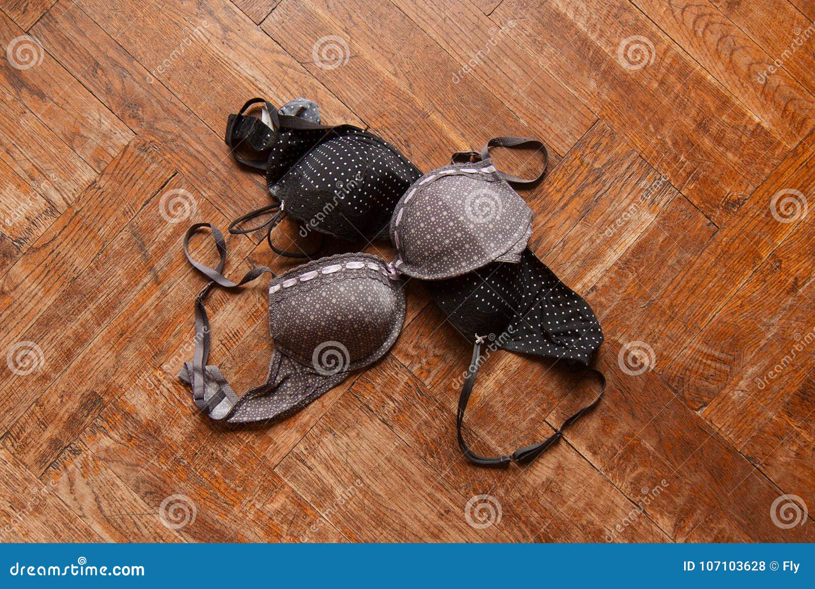 Bra on the wooden floor. Stock Photo