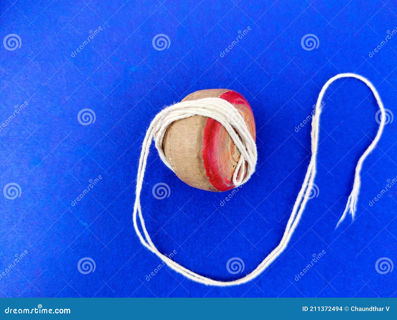 Top View of Wooden Spinning Top with a White Rope Stock Photo Image