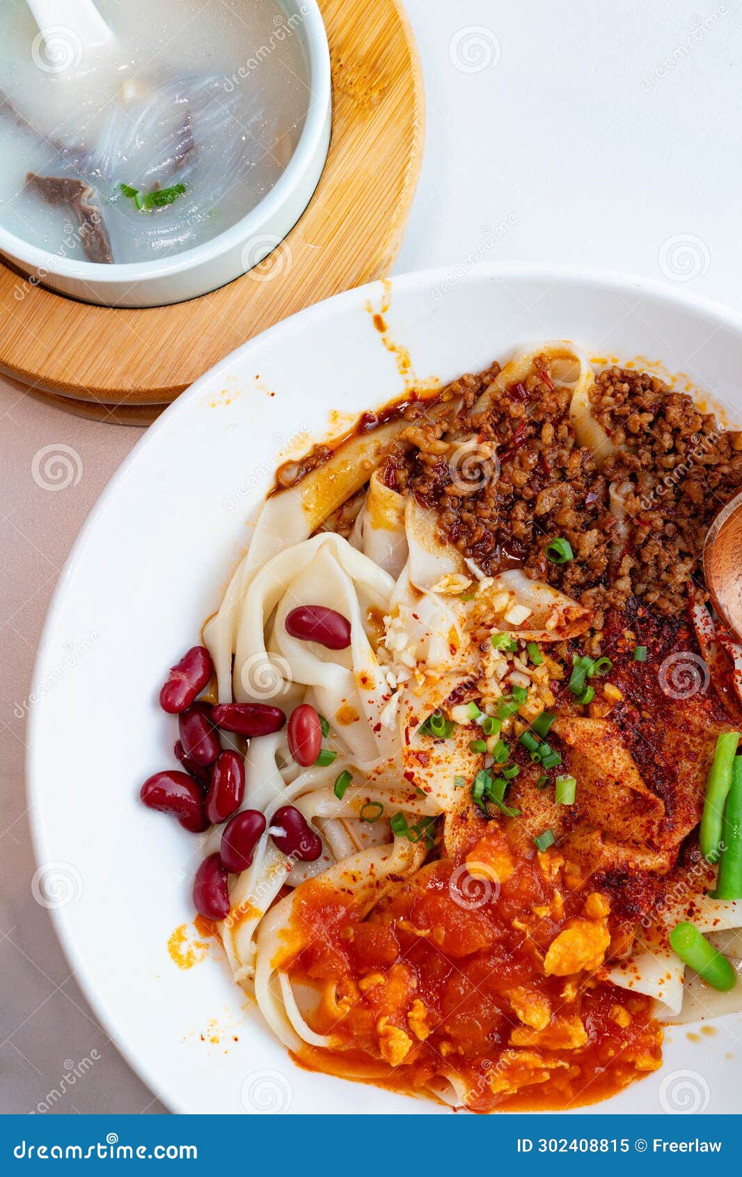 xi an biangbiang noodles with mutton entrails soup at vertical composition