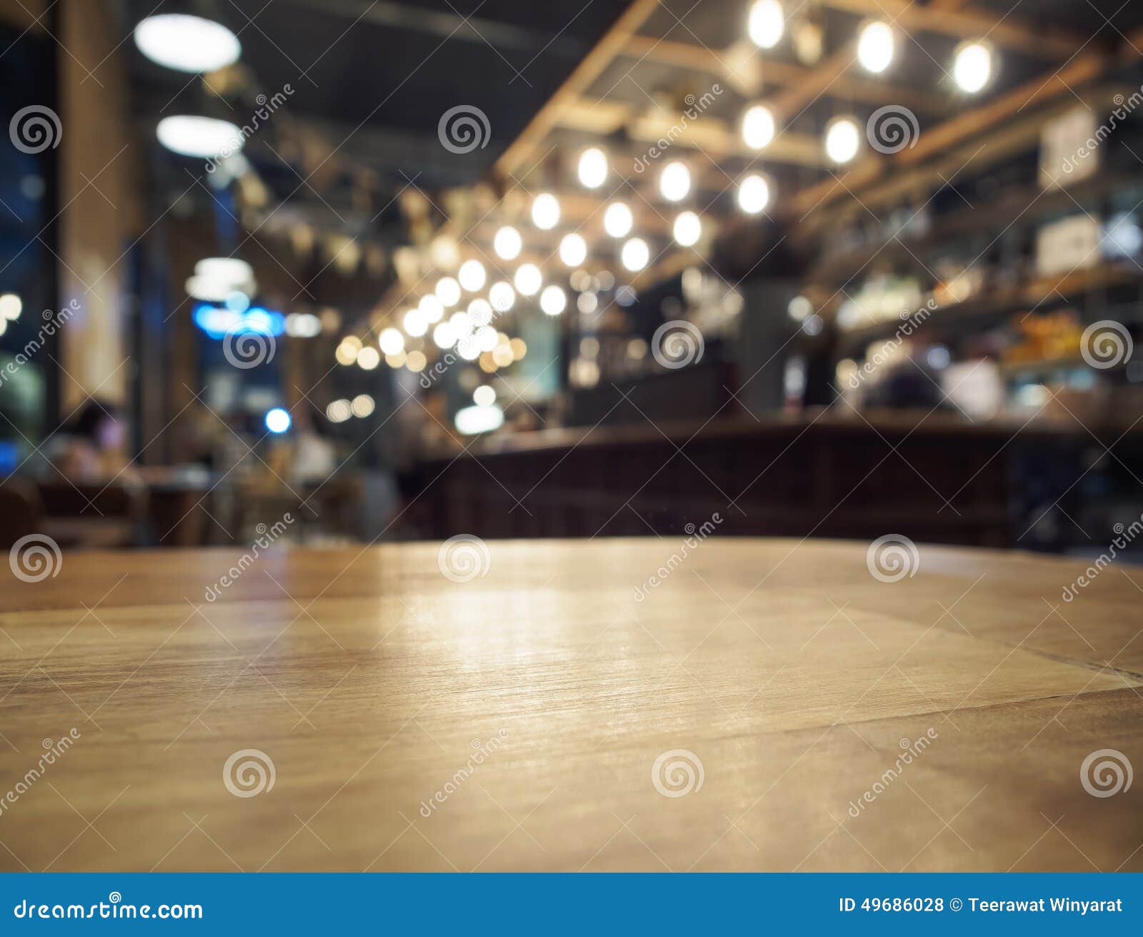 top of wooden table with blurred bar restaurant background