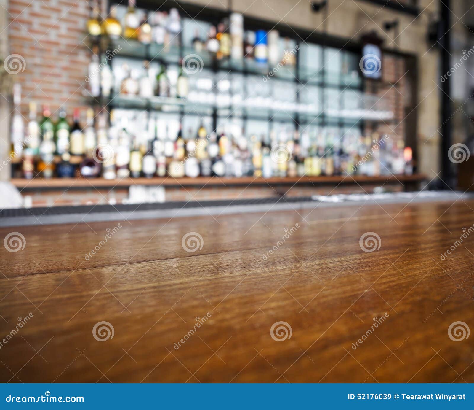 top of wooden table counter with blurred bar background