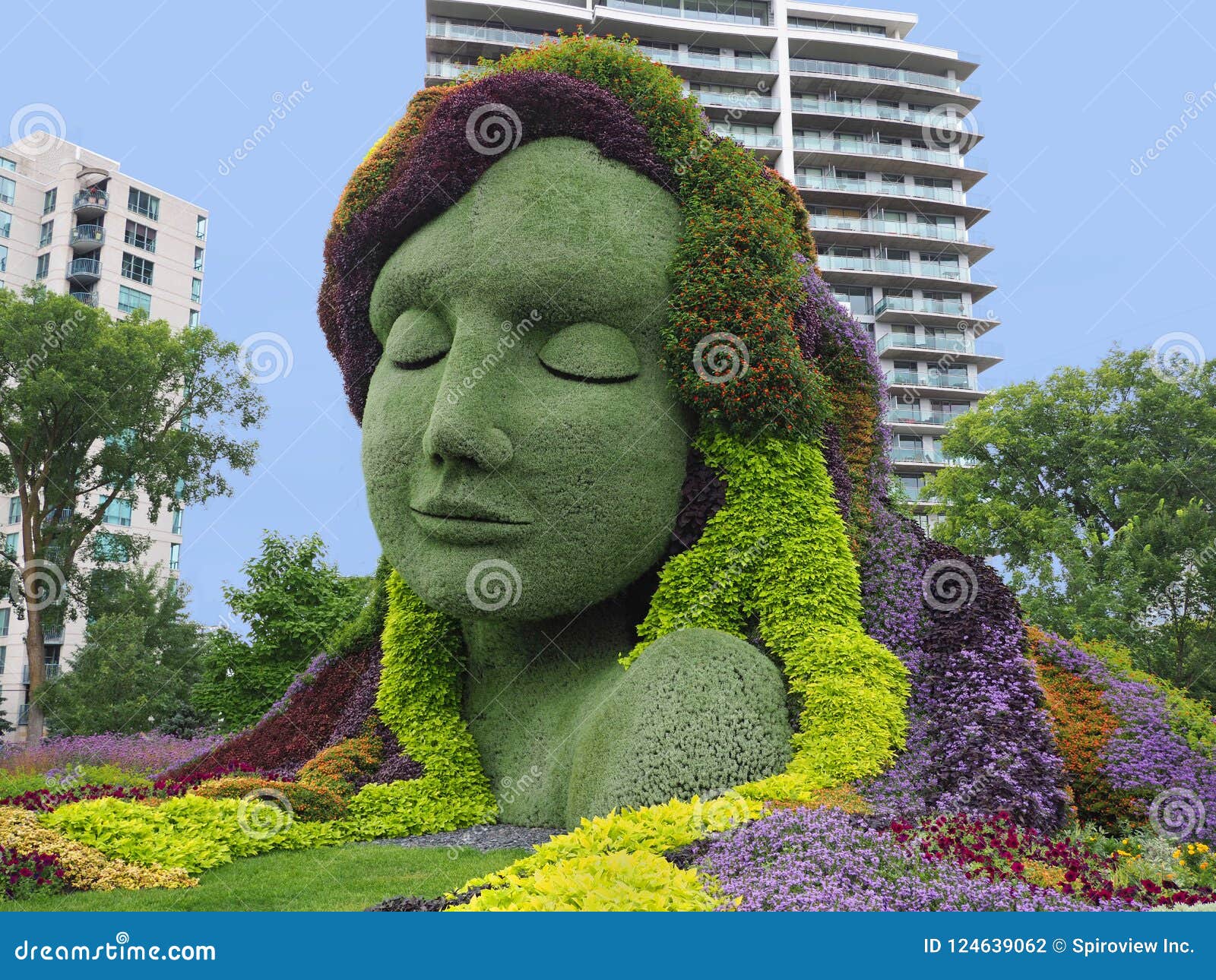 Topiary Sculpture Of A Man With A Cart Editorial Image CartoonDealer