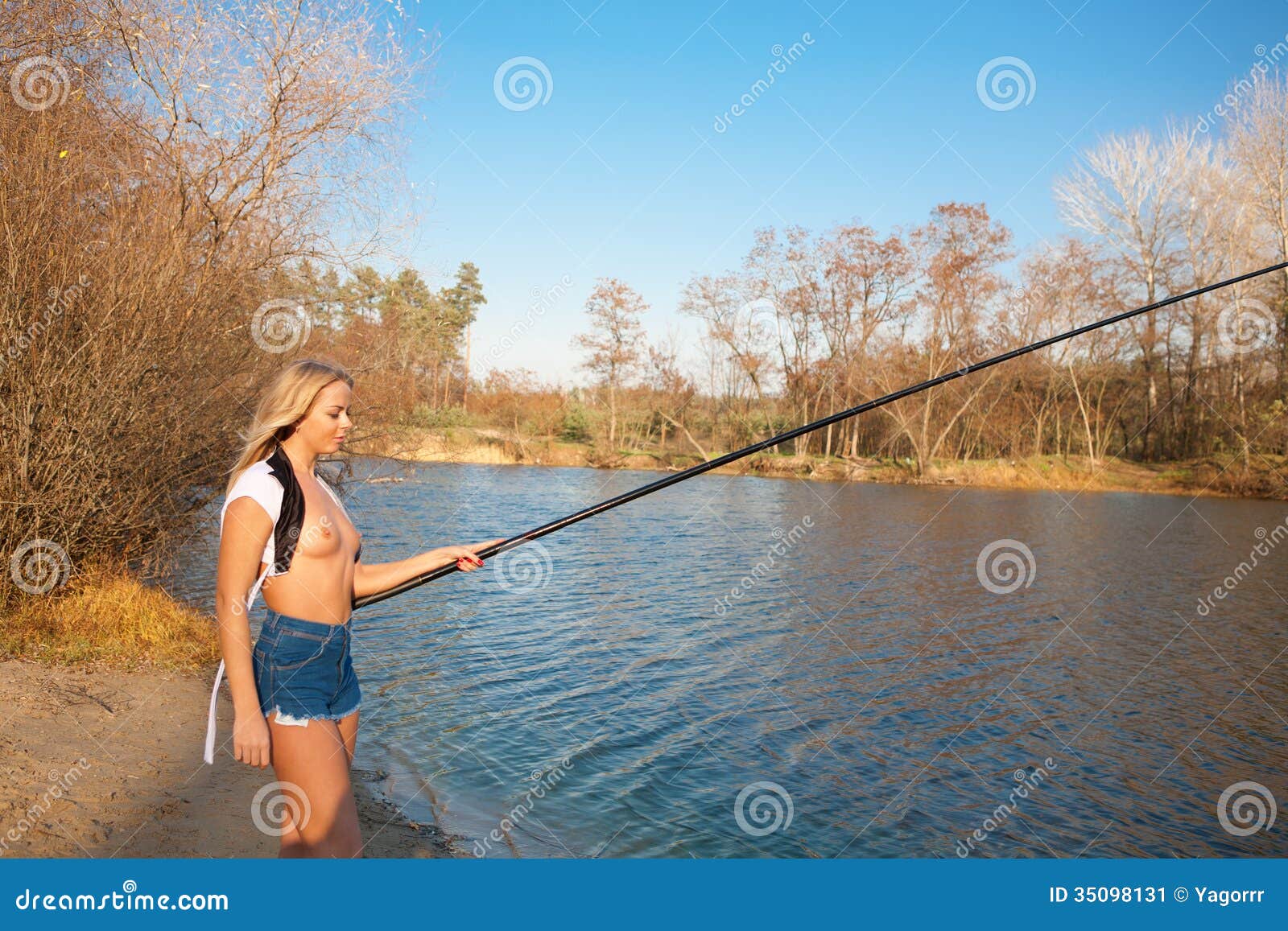 Topless Girl Fishing at the River Stock Image - Image of sunset