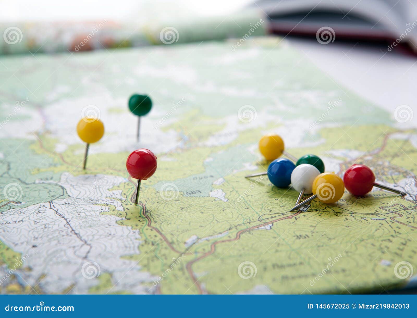 Topographic Map with Colored Needles Pushpins Close Up Stock Image