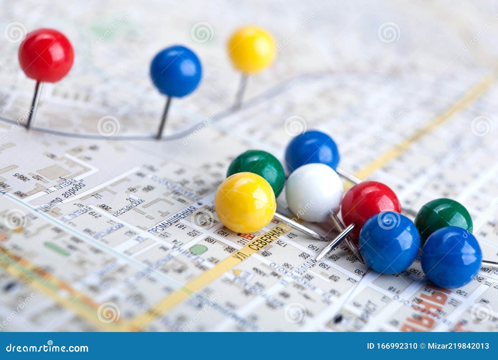 Topographic Map with Colored Needles Pushpins Close Up Stock Photo