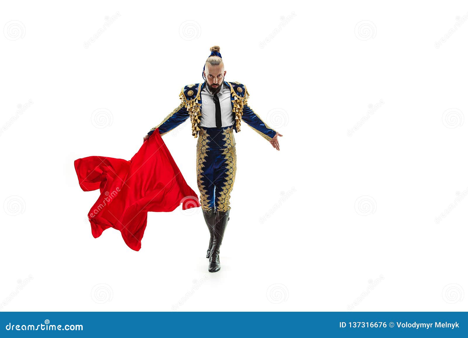 torero in blue and gold suit or typical spanish bullfighter  over white