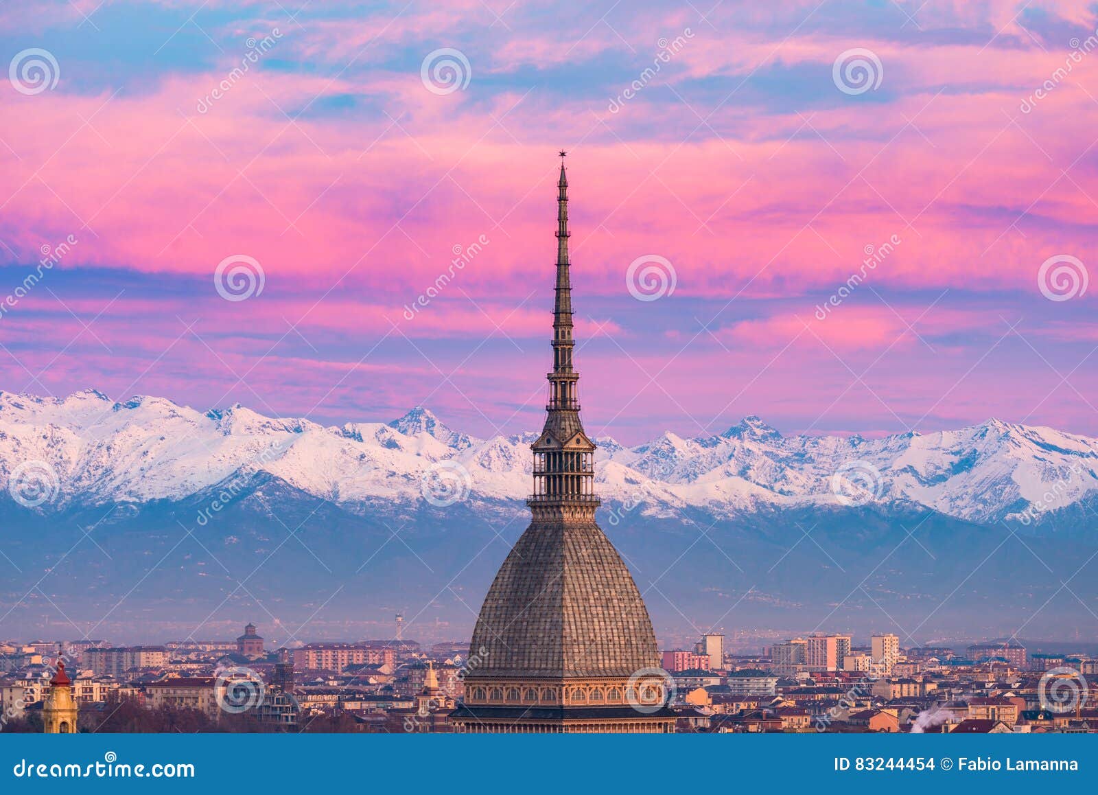 torino turin, italy: cityscape at sunrise with details of the mole antonelliana towering over the city. scenic colorful light on