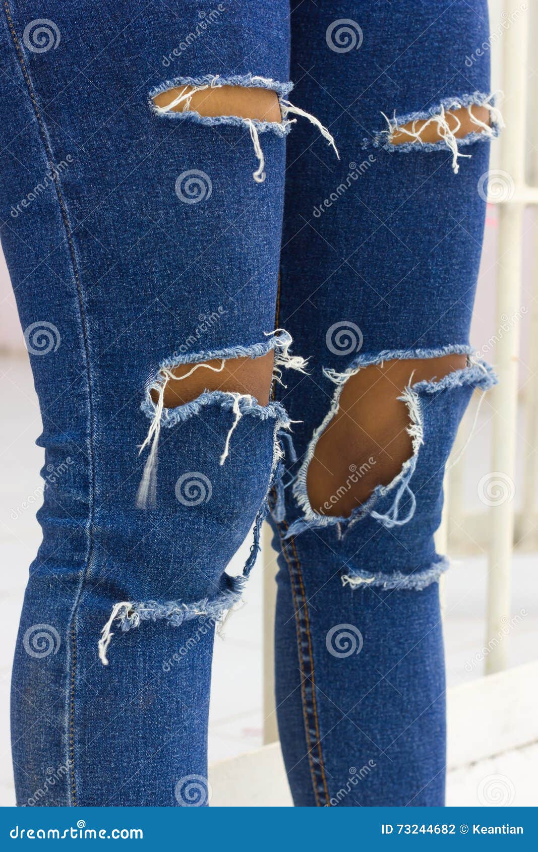 Torn jeans with jail. stock photo. Image of overestimated - 73244682