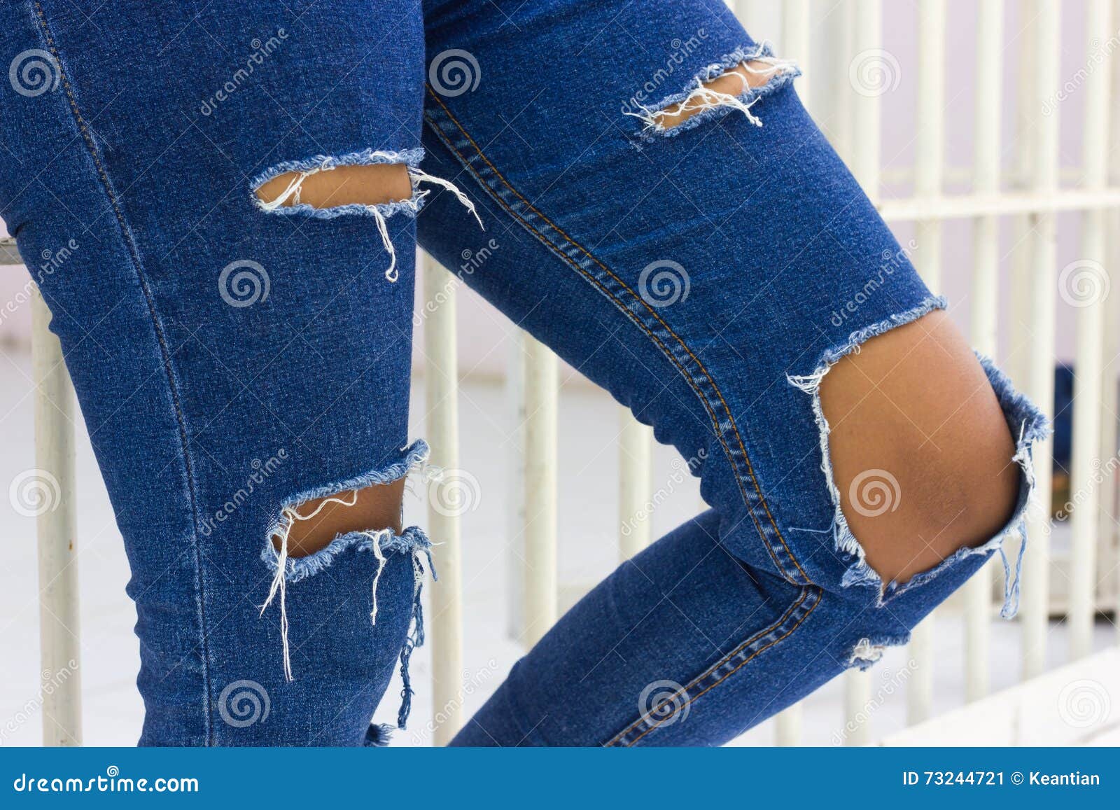 Torn jeans with jail. stock image. Image of pattern, denim - 73244721