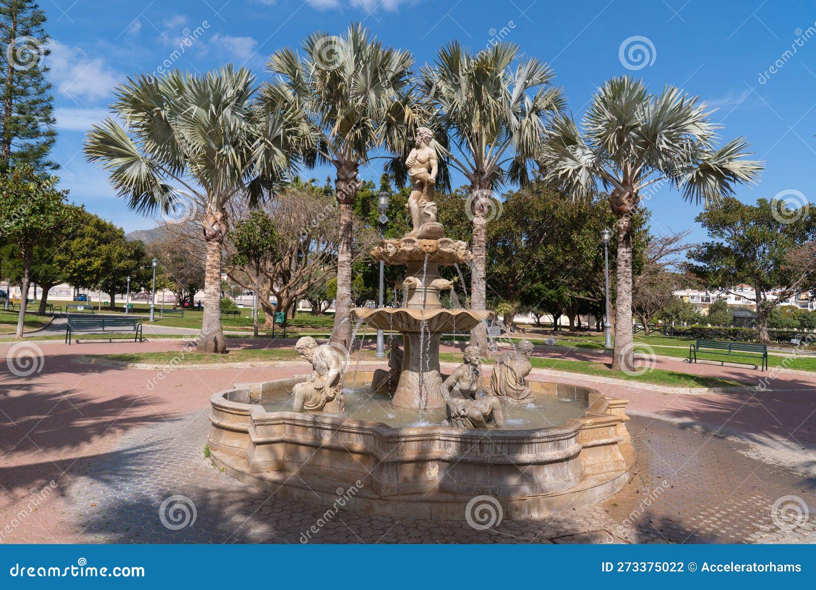 torremolinos park statue and palm trees in parque la bateria andalusia spain
