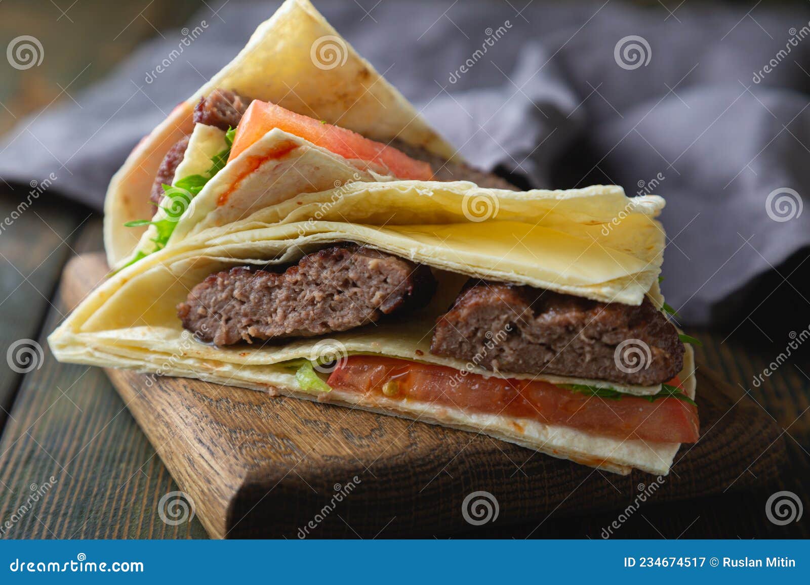 Tortilla Burger. Hamburger with Cheese and Vegetables Stock Image