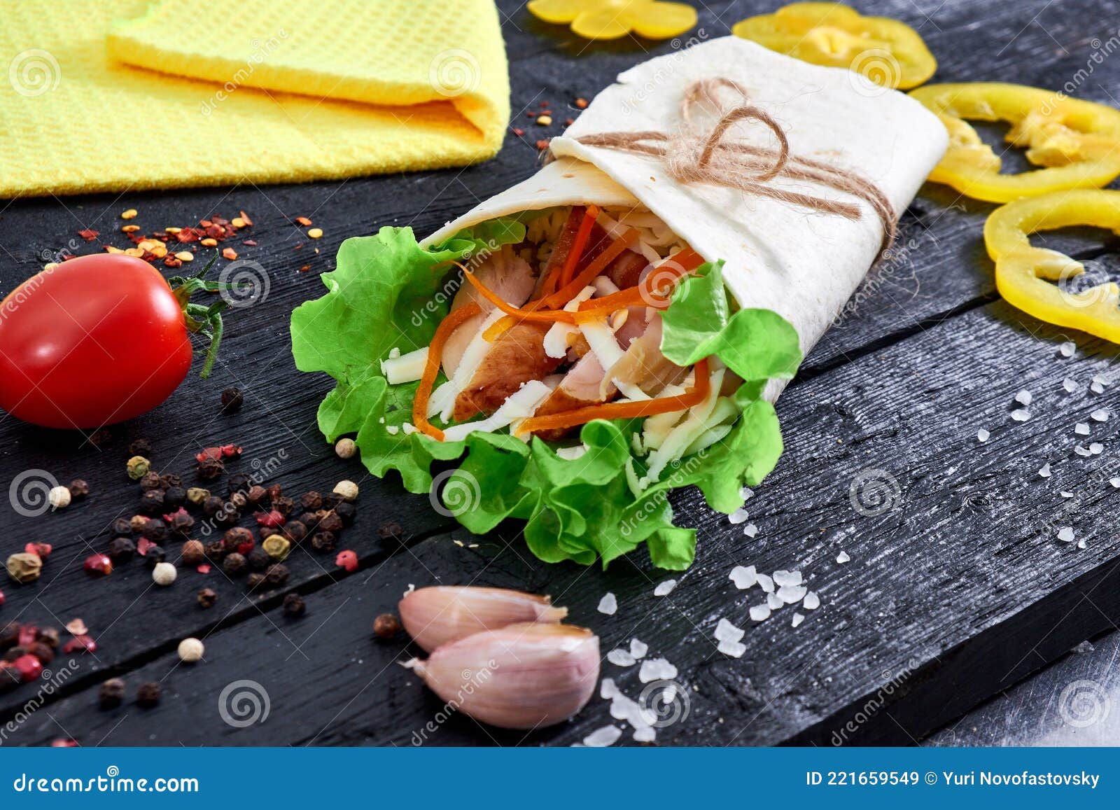 Tortilla Wrap Sandwich with Meat and Wegetables on Wood Stock Image