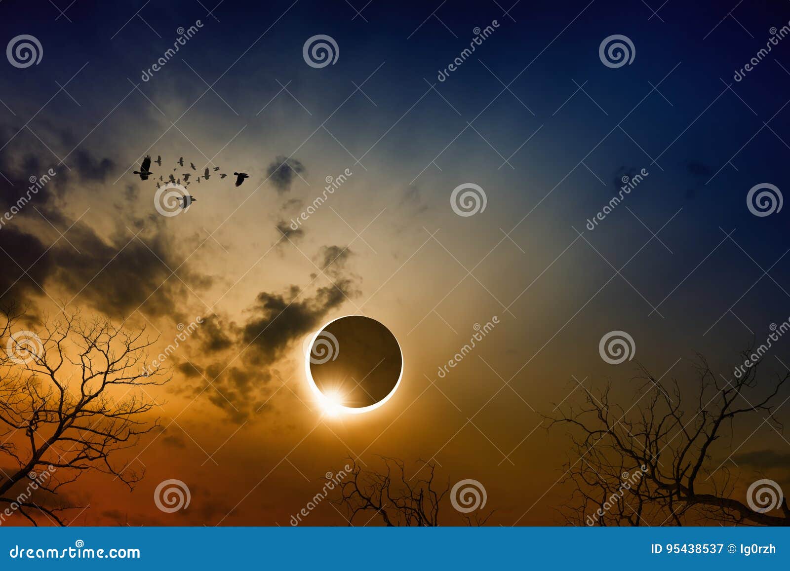 total solar eclipse in dark red glowing sky