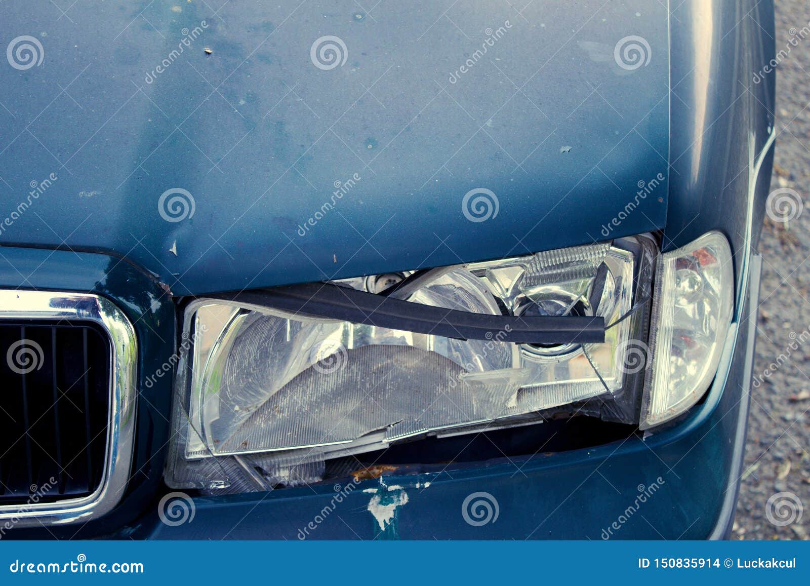 Broken Left Light on Dark Car. Stock Photo Image of sheets, scraped