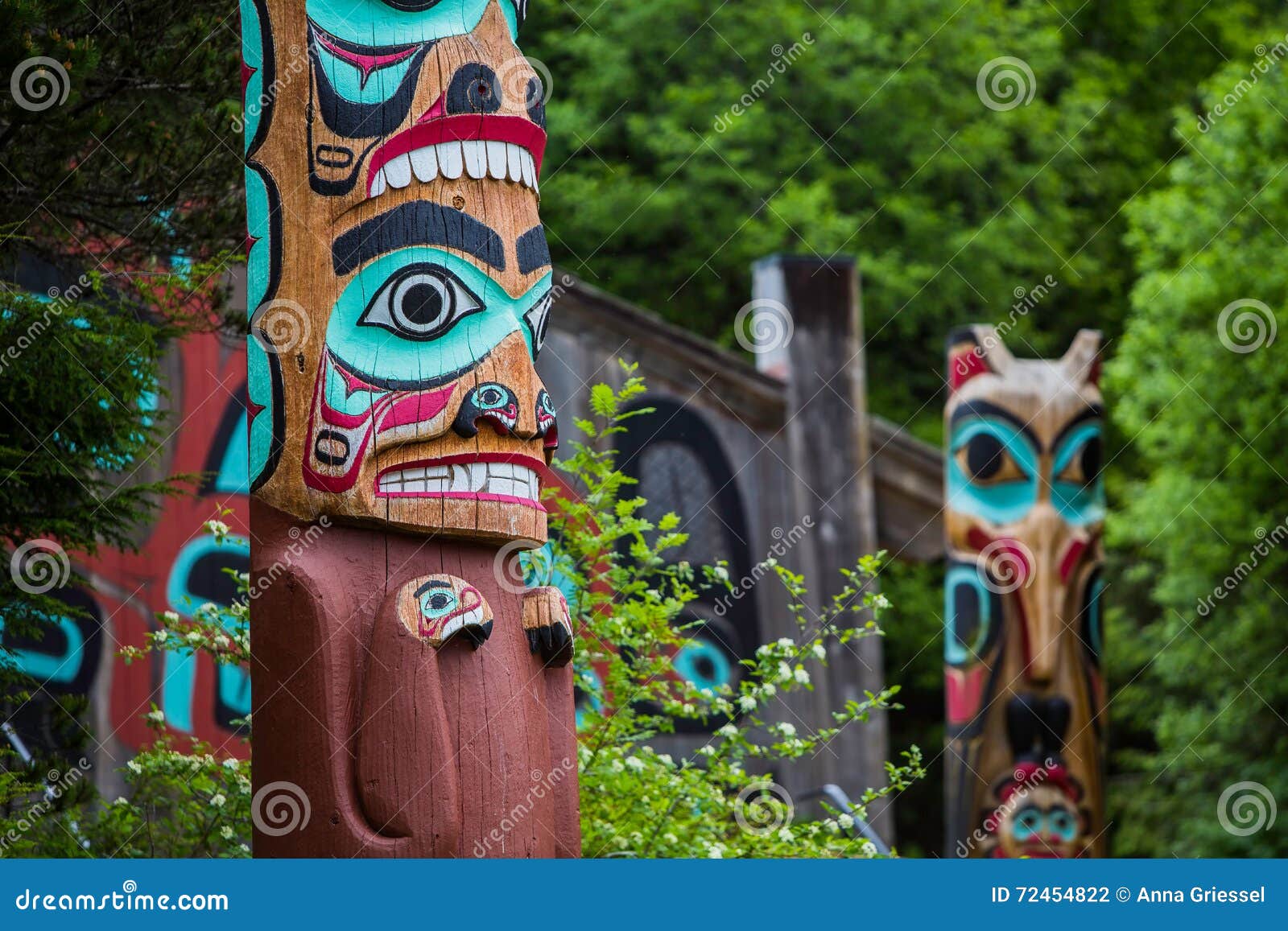 totem poles near saxman tribal house