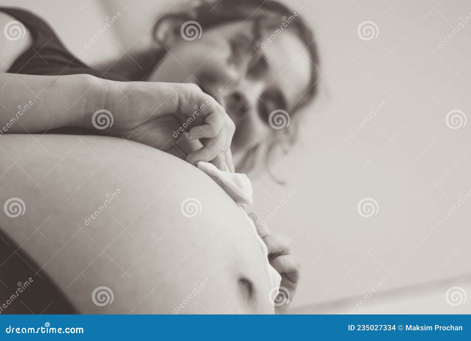 Touching Photo of Pregnancy Moments Young Expectant Mother with Socks on  Her Belly Stock Photo - Image of belly, expectant: 235027334