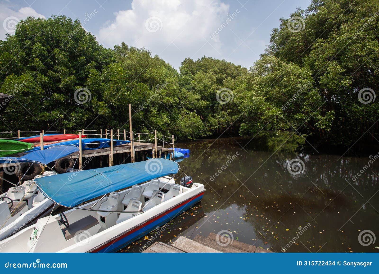 tourist boat in the mangrove nature tourism park area in muara angke, pantai indah kapuk, jakarta