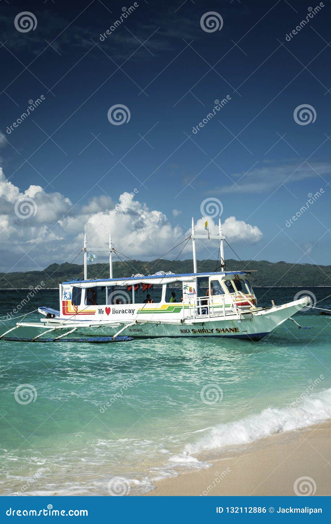 Tourist Boats on Puka Beach in Tropical Boracay Island Philippines