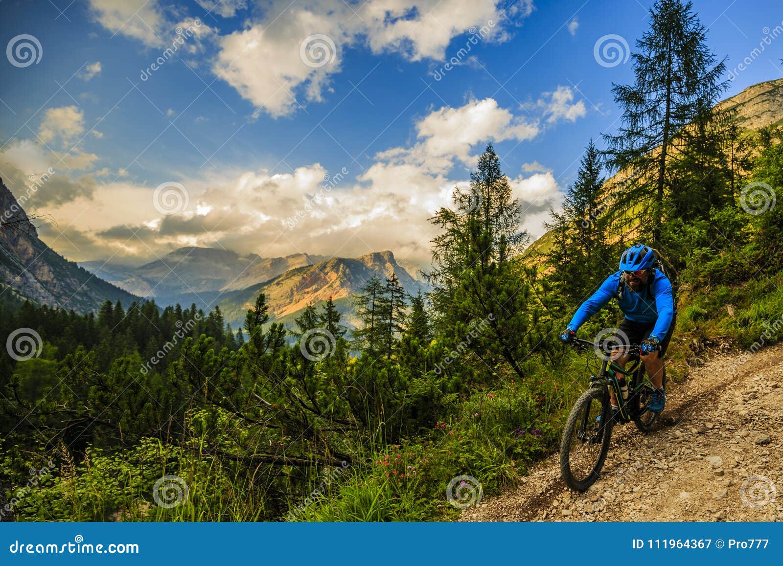 tourist cycling in cortina d`ampezzo, stunning rocky mountains o