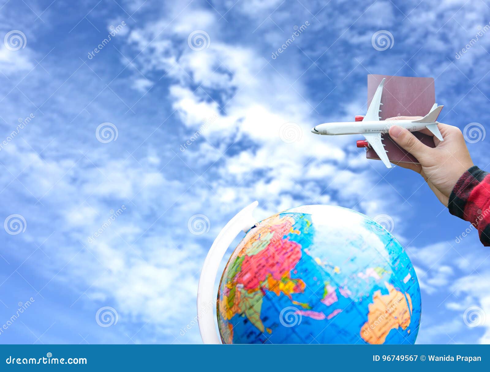 tourist holding airplane flight travel and passport traveller fly travelling citizenship air on blue sky background