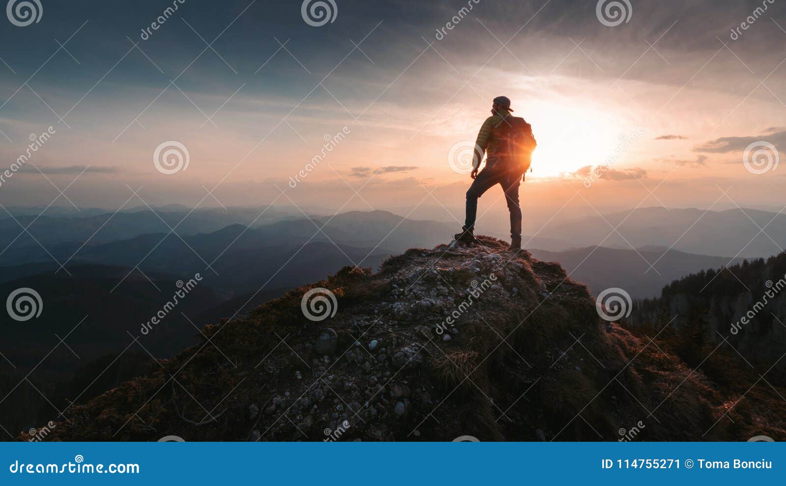 tourist man hiker on top of the mountain. active life concept