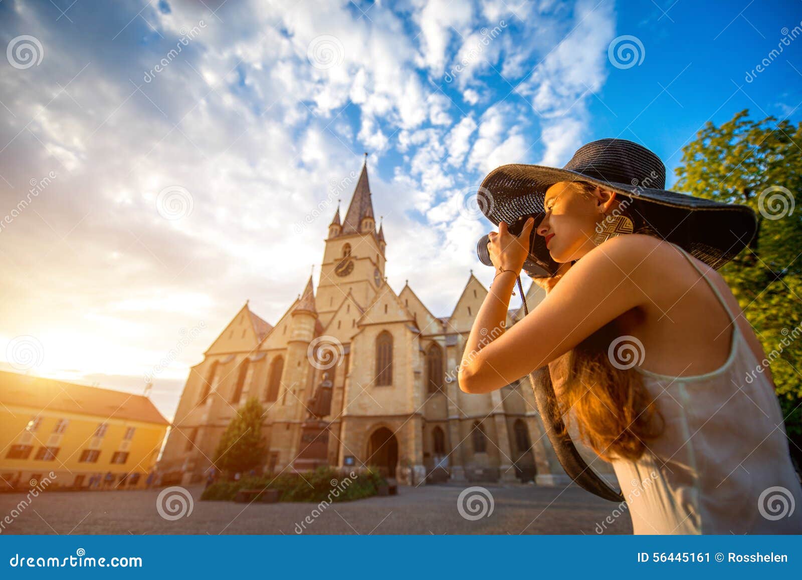 tourist photographing ghotic cathedral in romania