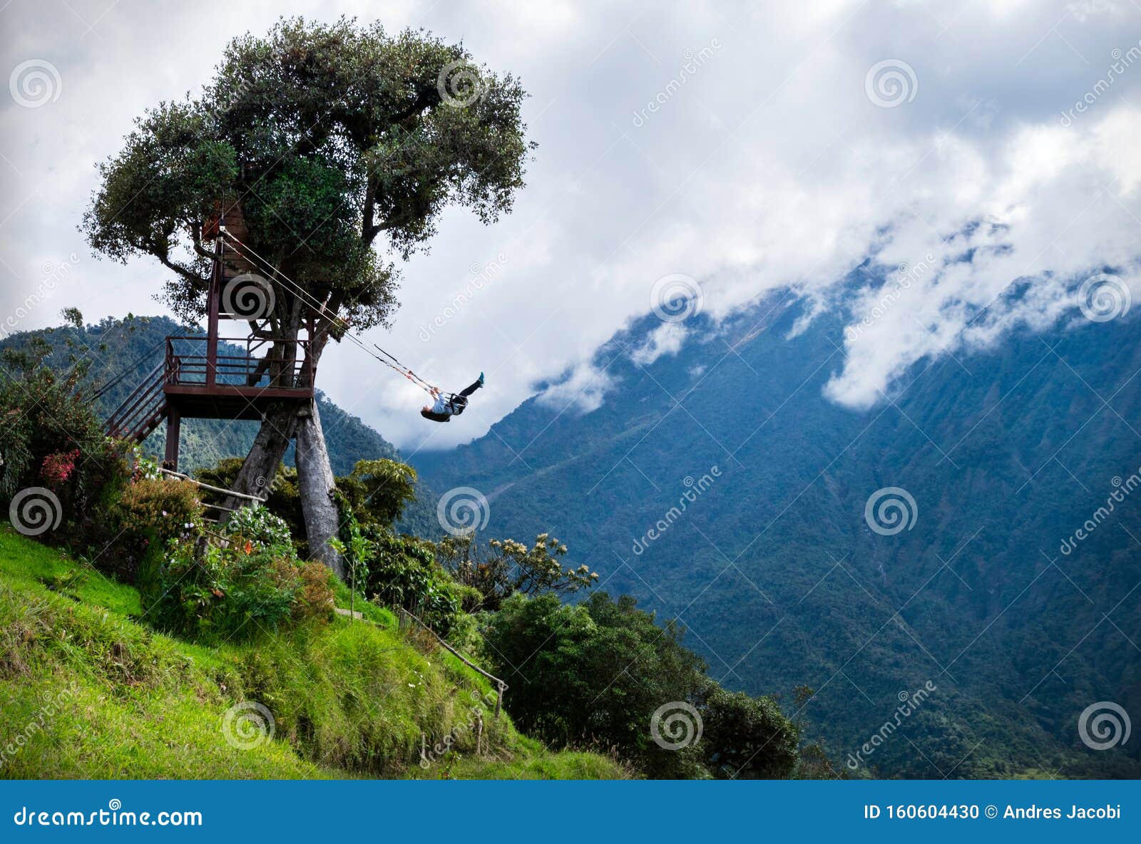 tourist swinging on the swing of the end of the world columpio del fin del mundo in baÃÂ±os, ambato province, ecuador.