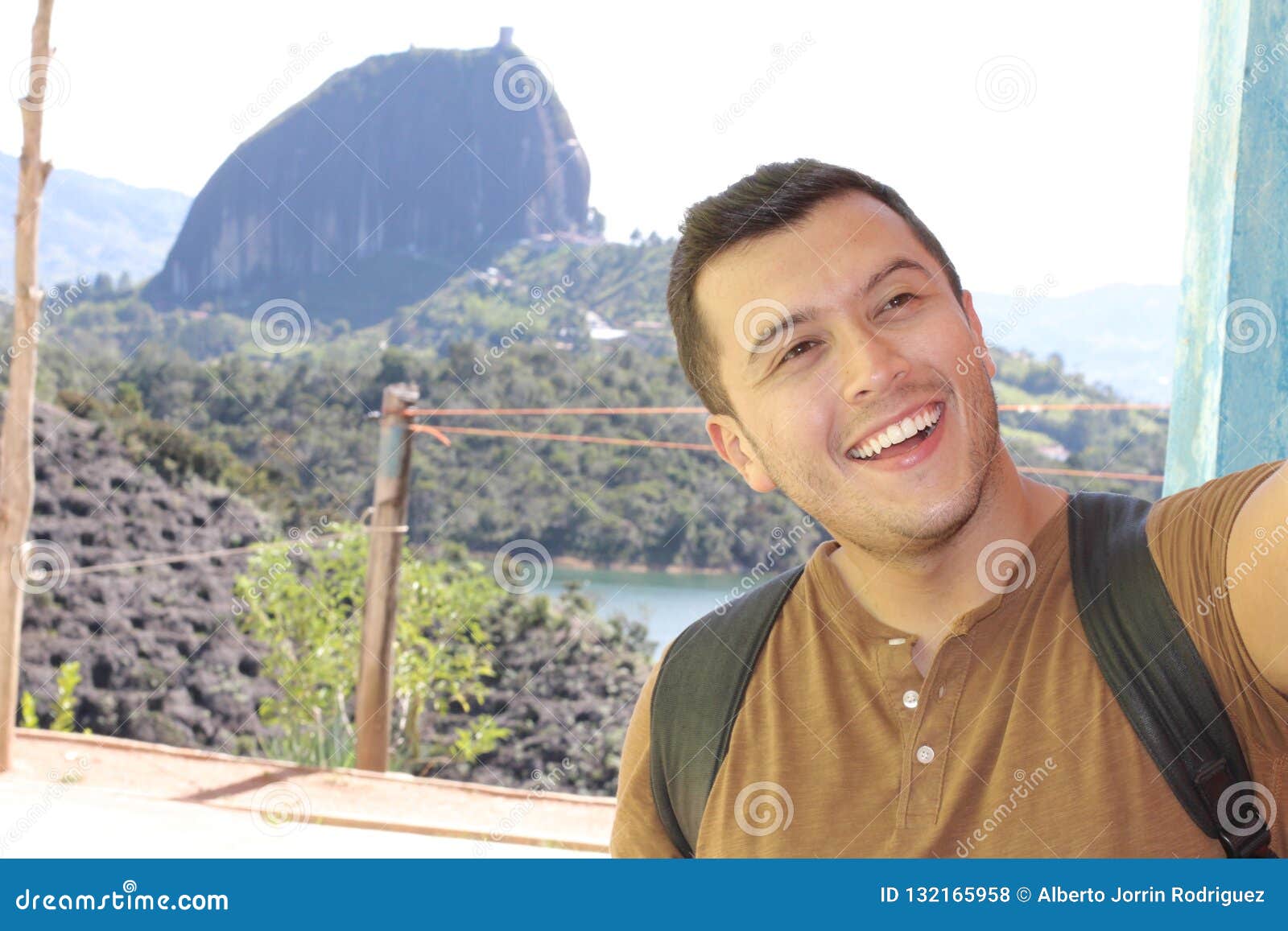 tourist taking selfie in el peÃÂ±ol, guatapÃÂ©, colombia