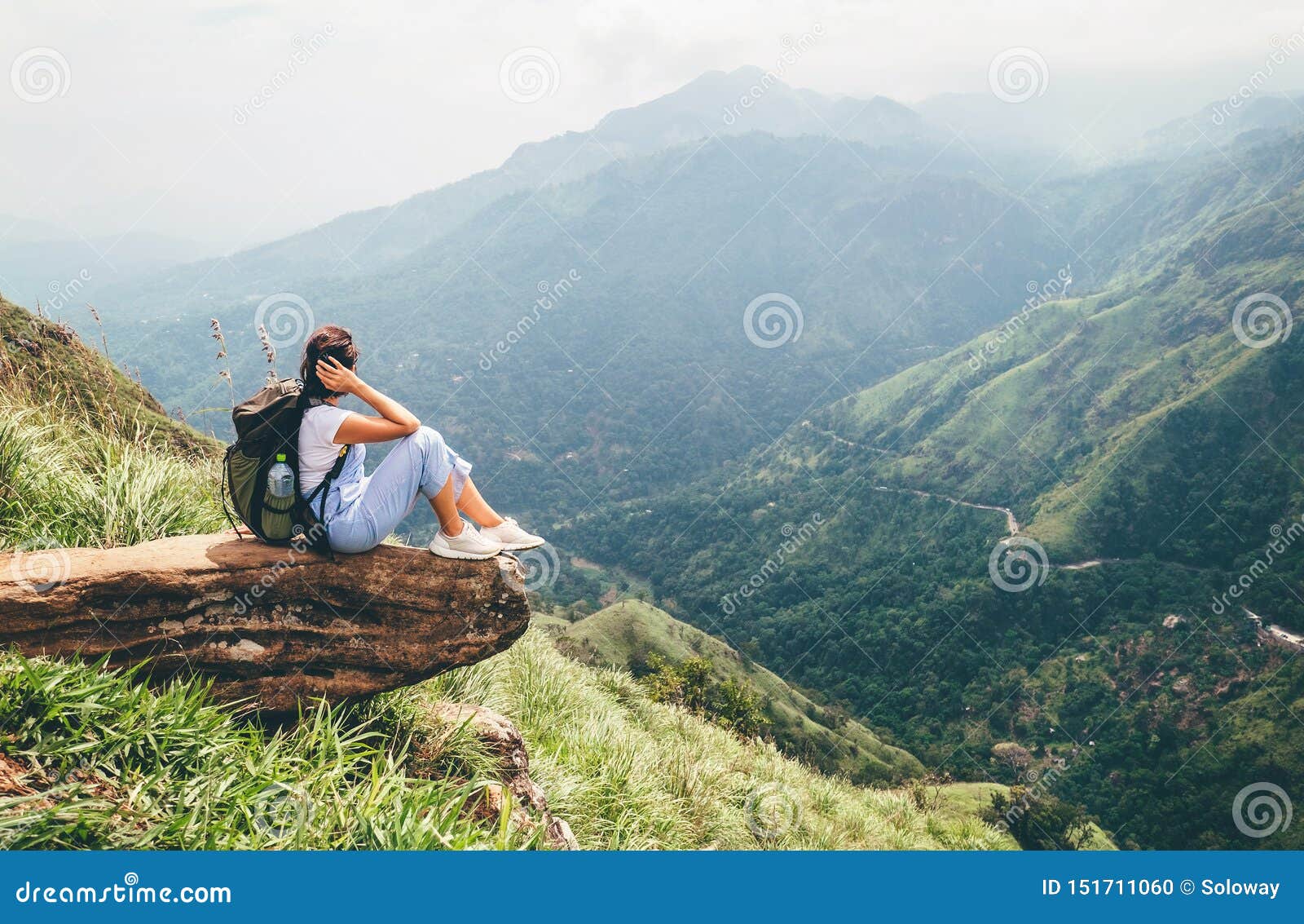 tourist woman enjoy with beautiful view on mountains in ella, sri lanka, little adam peak