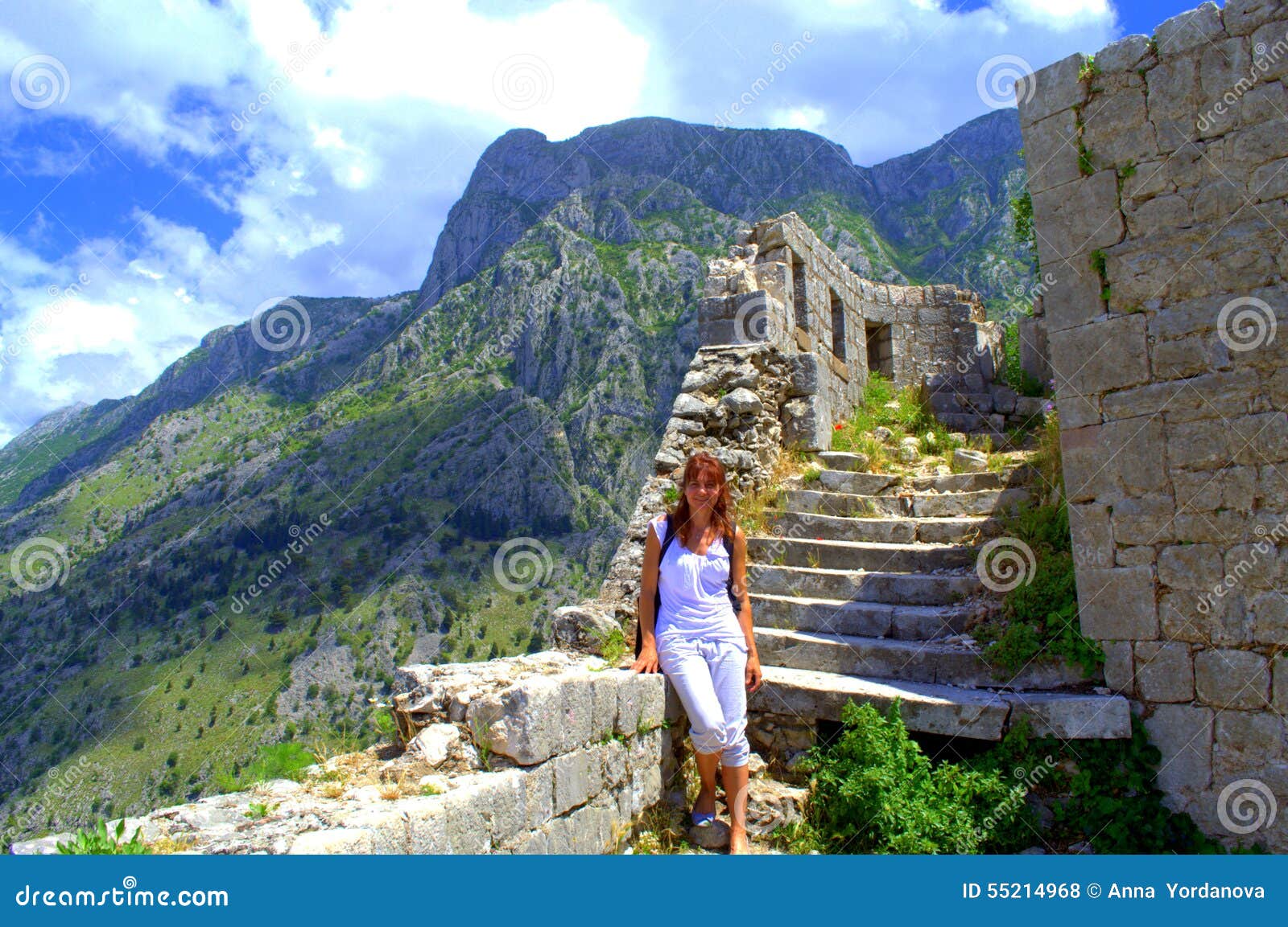 tourist woman hiking old montenegro fortress sightseeing medieval kotor ruins against picturesque mountain ridges nice 55214968