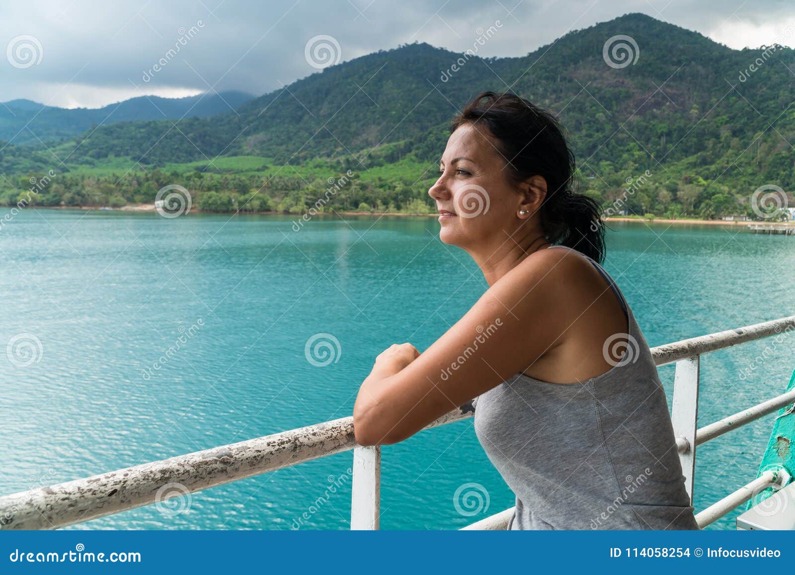 tourist woman looking at sea view from boat