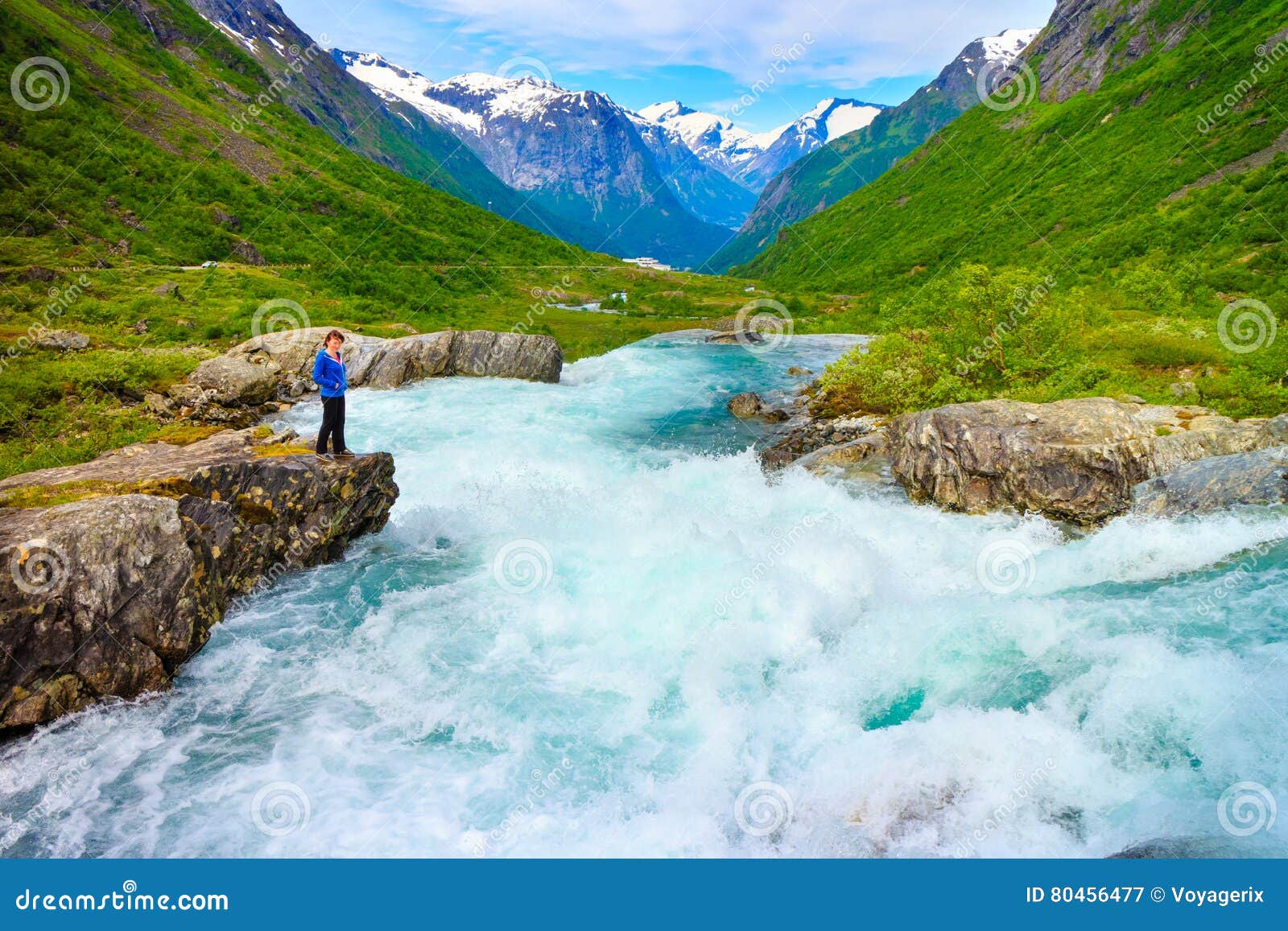 tourist woman by videfossen waterfall in norway