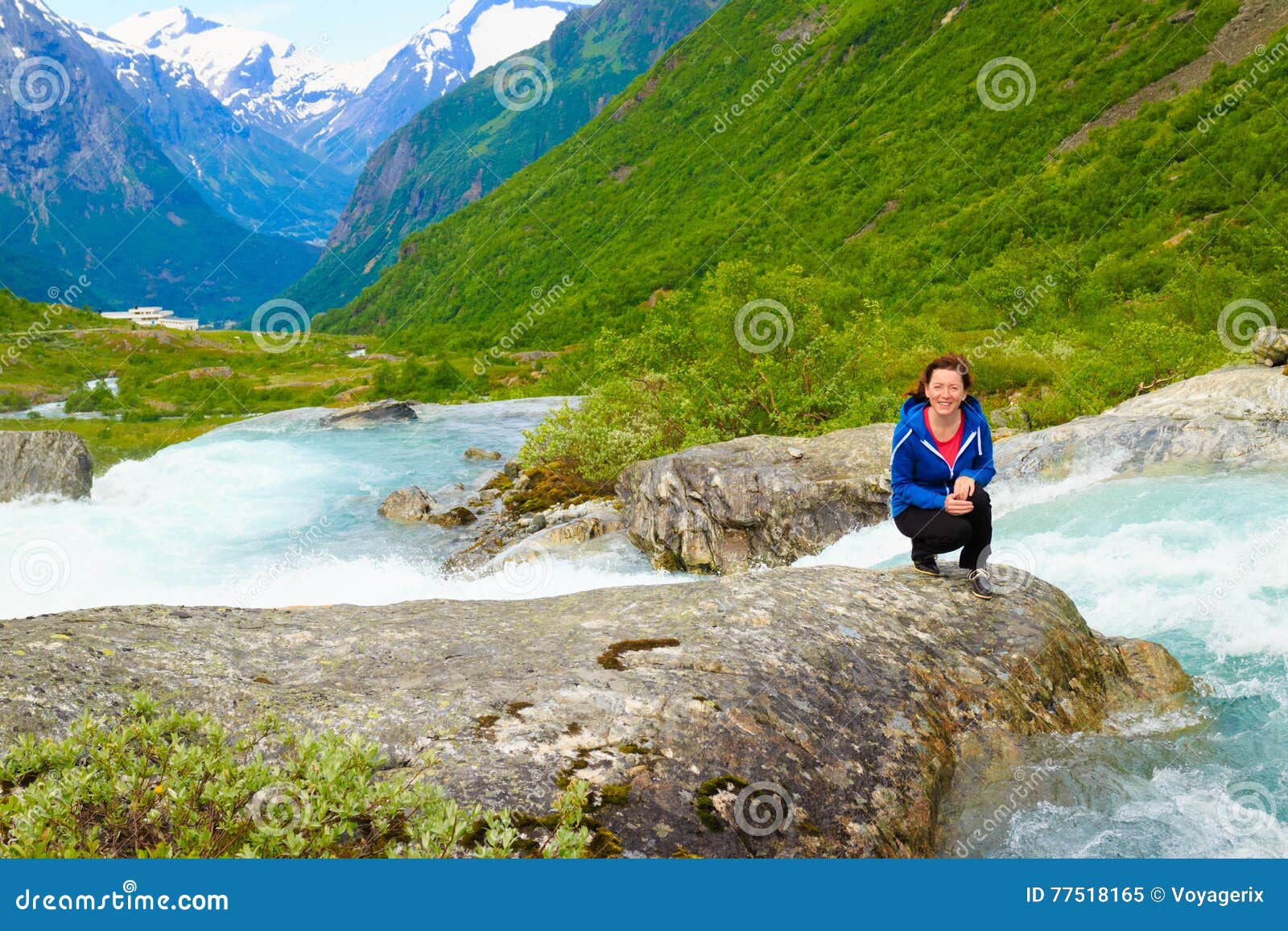 tourist woman by videfossen waterfall in norway