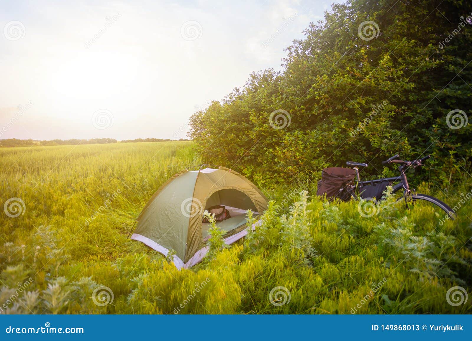 touristic camp on the forest glade at the sunset
