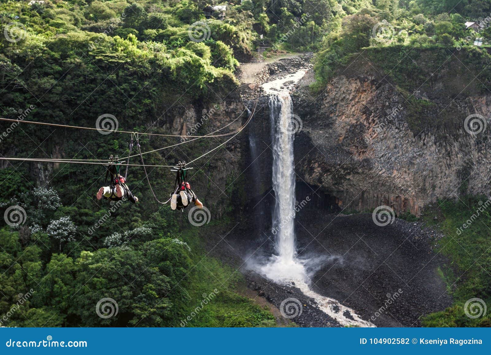 tourists gliding on the zip line trip, cascades route, banos, ecuador