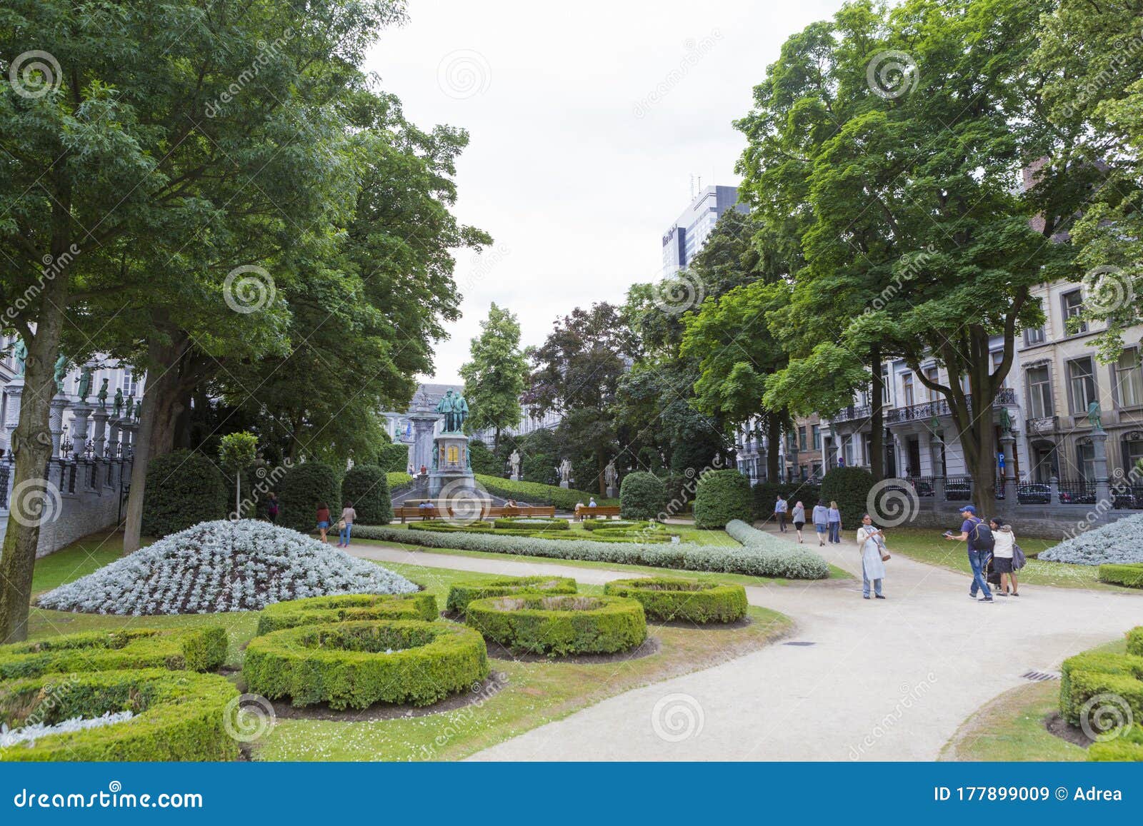 tourists and local people relaxing in square of petit sablon park