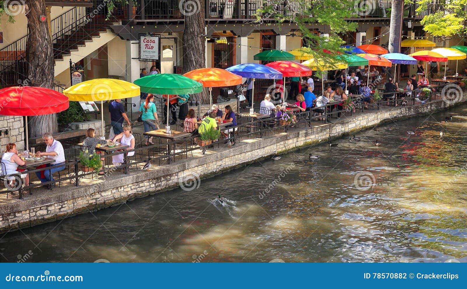 Tourists at Restaurant Along the San Antonio River Walk in Texas