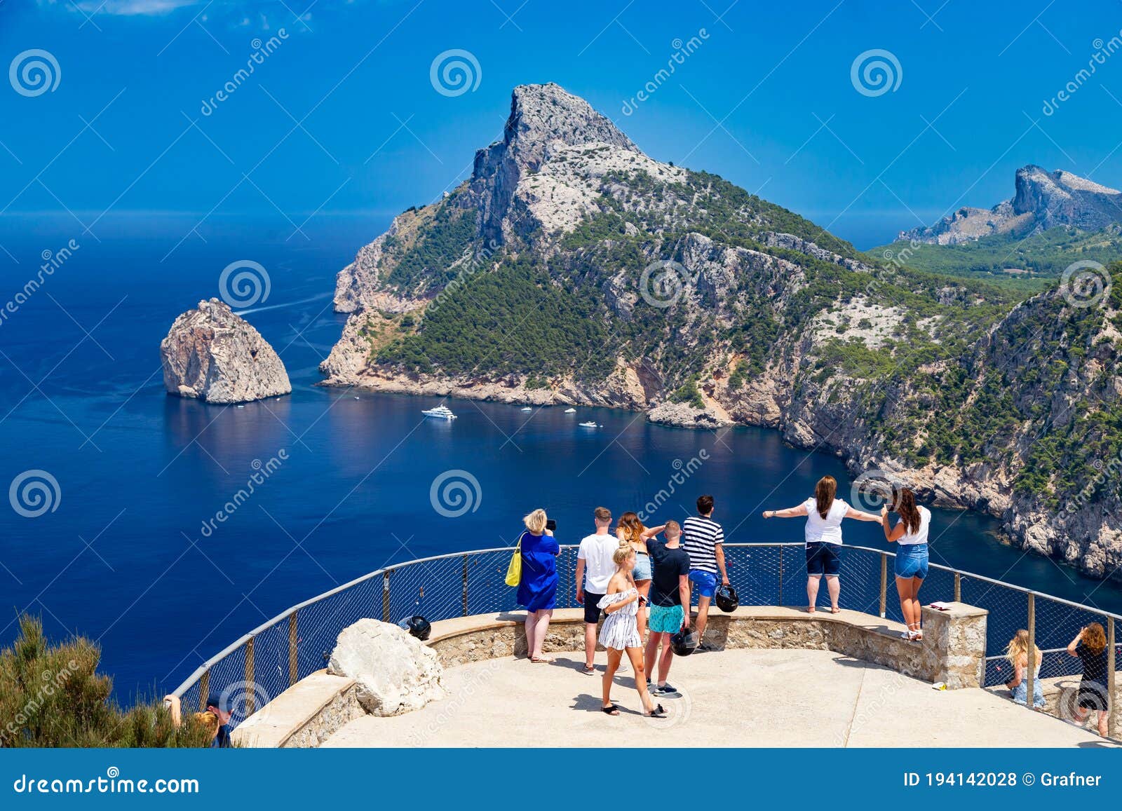 tourists at vantage point with view mirador es colomer on punta nau at cap formentor majorca mallorca. balearic islands country of
